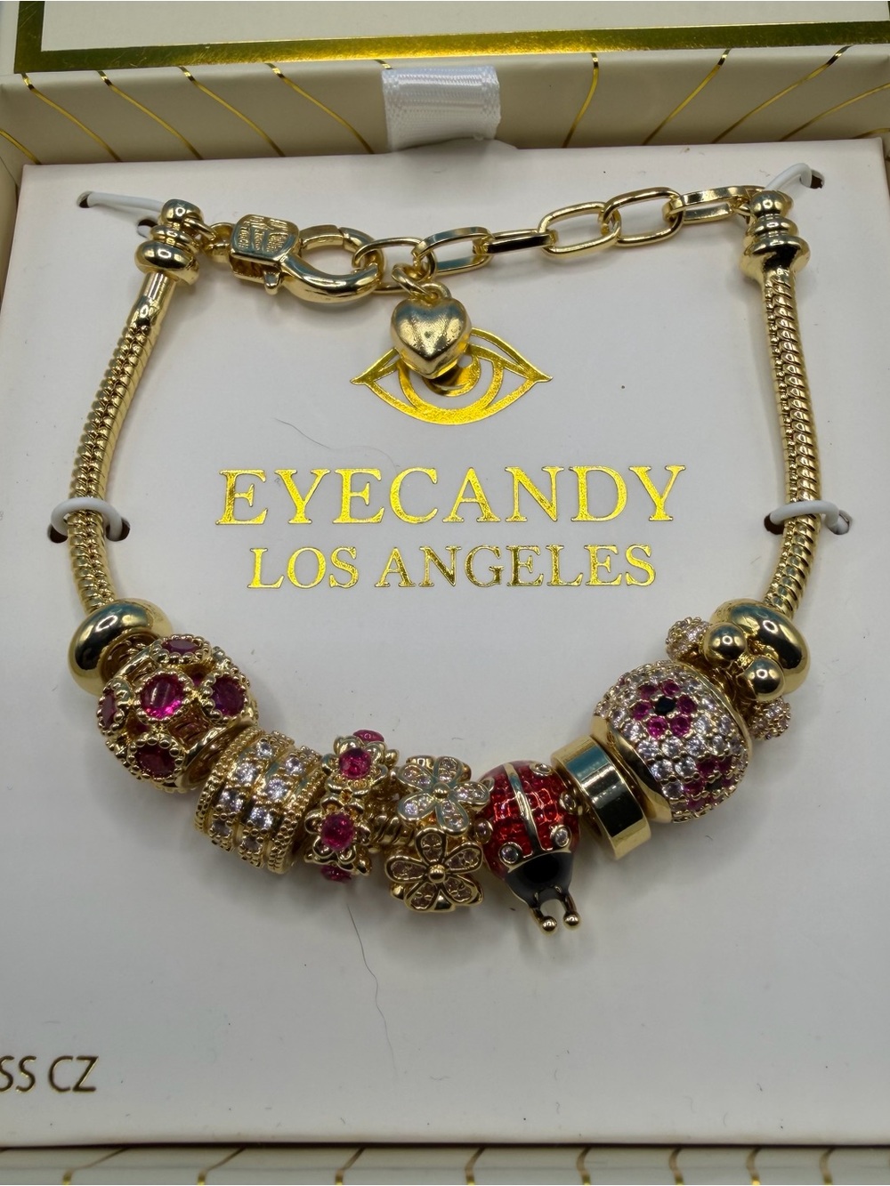 eye candy Gold Charm Bracelet with Pink and Red Crystal Beads